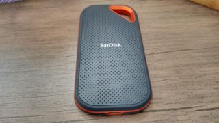 A black and orange SanDisk Extreme PRO Portable SSD