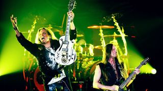 Guitarists Joel Hoekstra (L) and Reb Beach of Whitesnake perform at The Joint inside the Hard Rock Hotel & Casino as the band tours in support of "The Purple Album" on June 4, 2015 in Las Vegas, Nevada. 