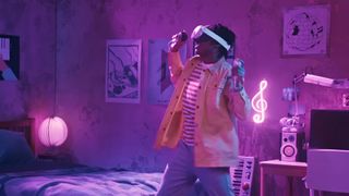 A man plays Just Dance VR on a Meta Quest 3 VR headset.
