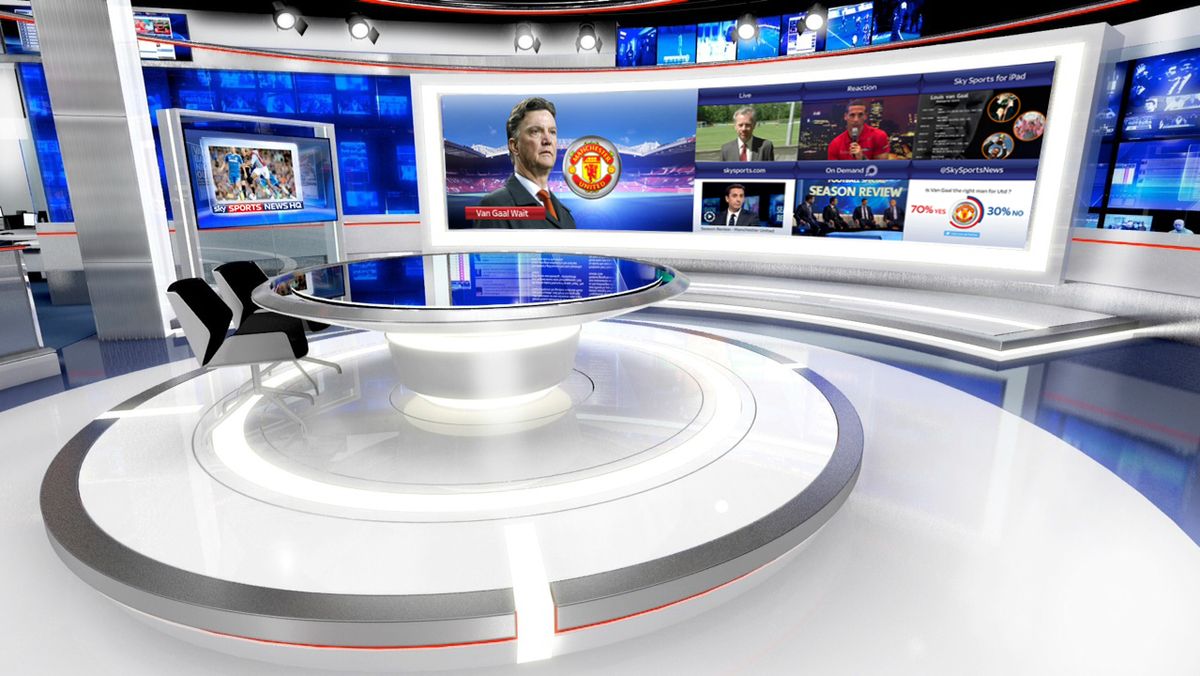  A Sky Sports studio set with a large curved screen displaying a football match and other sports news, with the text 'Sky Sports' and 'Sky Sports News HQ' visible.