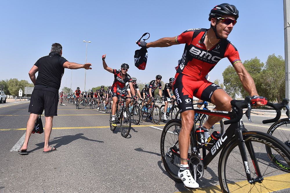 Gilbert picks up his lunch on stage 3 of the Abu Dhabi Tour