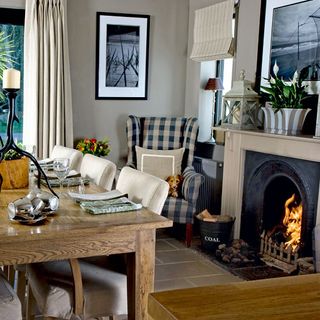 dining room with fireplace and wooden dining set
