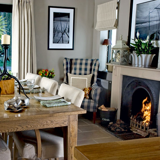 dining room with fireplace and wooden dining set