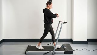Our reviewer testing the Bluefin Fitness Task 2.0 treadmill