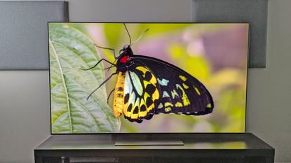 The LG G6 OLED TV showing an image of a butterfly, revealing rich green and yellow hues and deep black tones in its wings