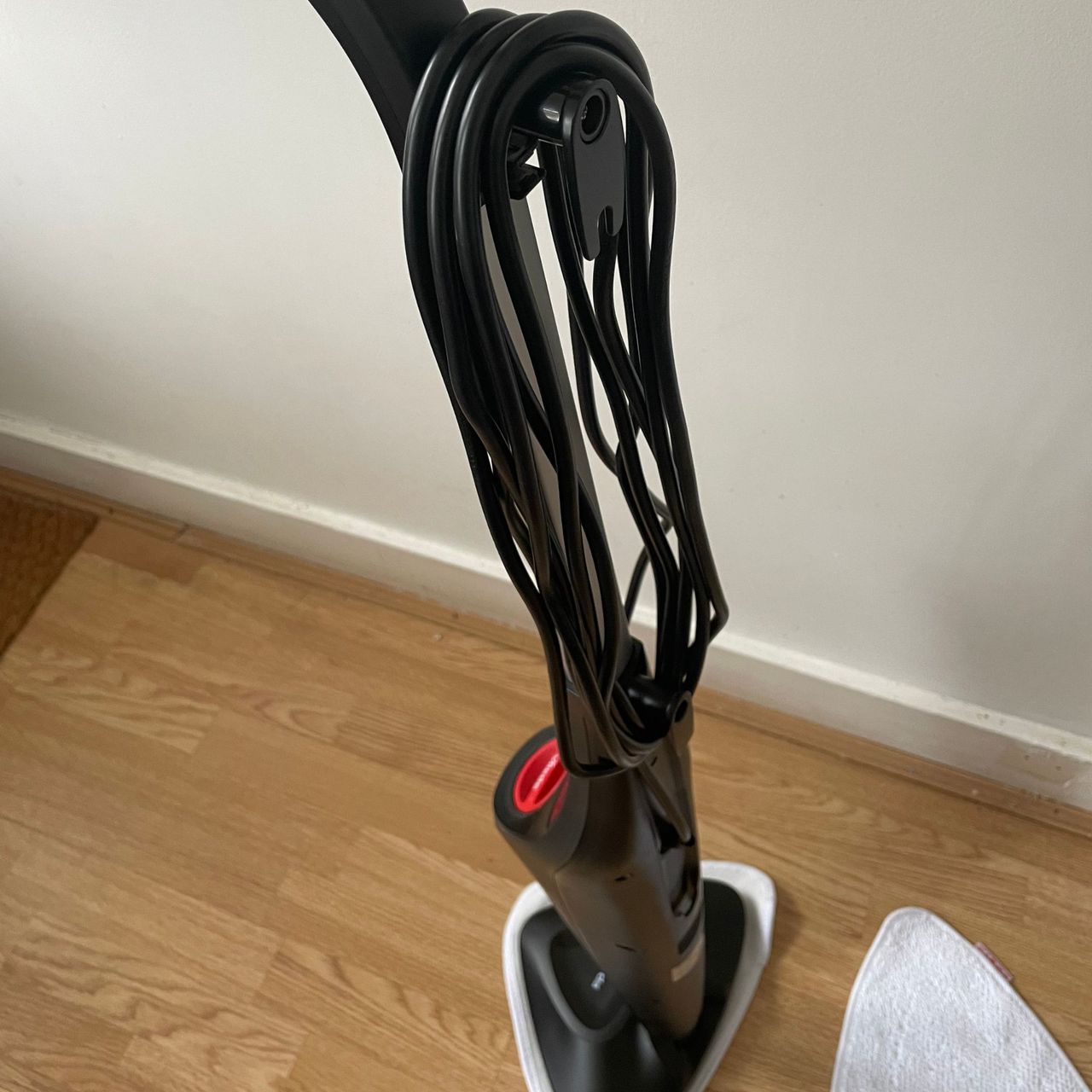 Vileda Steam Mop Plus with the cord wrapped around the cord holder