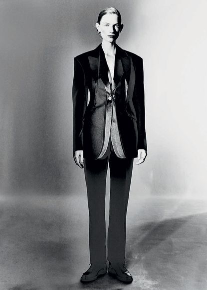 Females modelling Alexander McQueen black dress and black suit