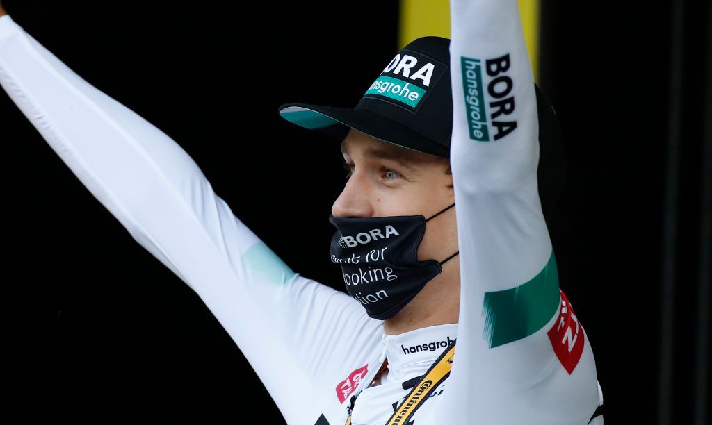 Stage winner Team Bora rider Germanys Lennard Kamna celebrates on the podium after winning the 16th stage of the 107th edition of the Tour de France cycling race 164 km between La Tour du Pin and VillarddeLans on September 15 2020 Photo by Sebastien Nogier various sources AFP Photo by SEBASTIEN NOGIERAFP via Getty Images