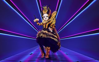 The Masked Singer Queen Bee on stage