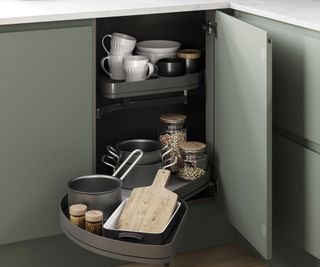 green kitchen unit with pull out storage