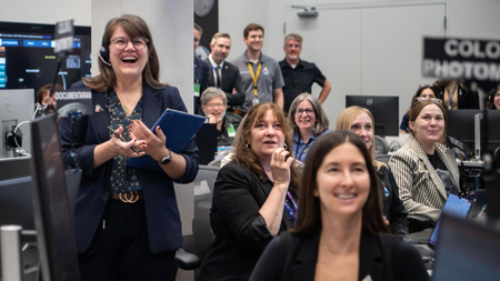 Mission team members are excited during Artemis II. 