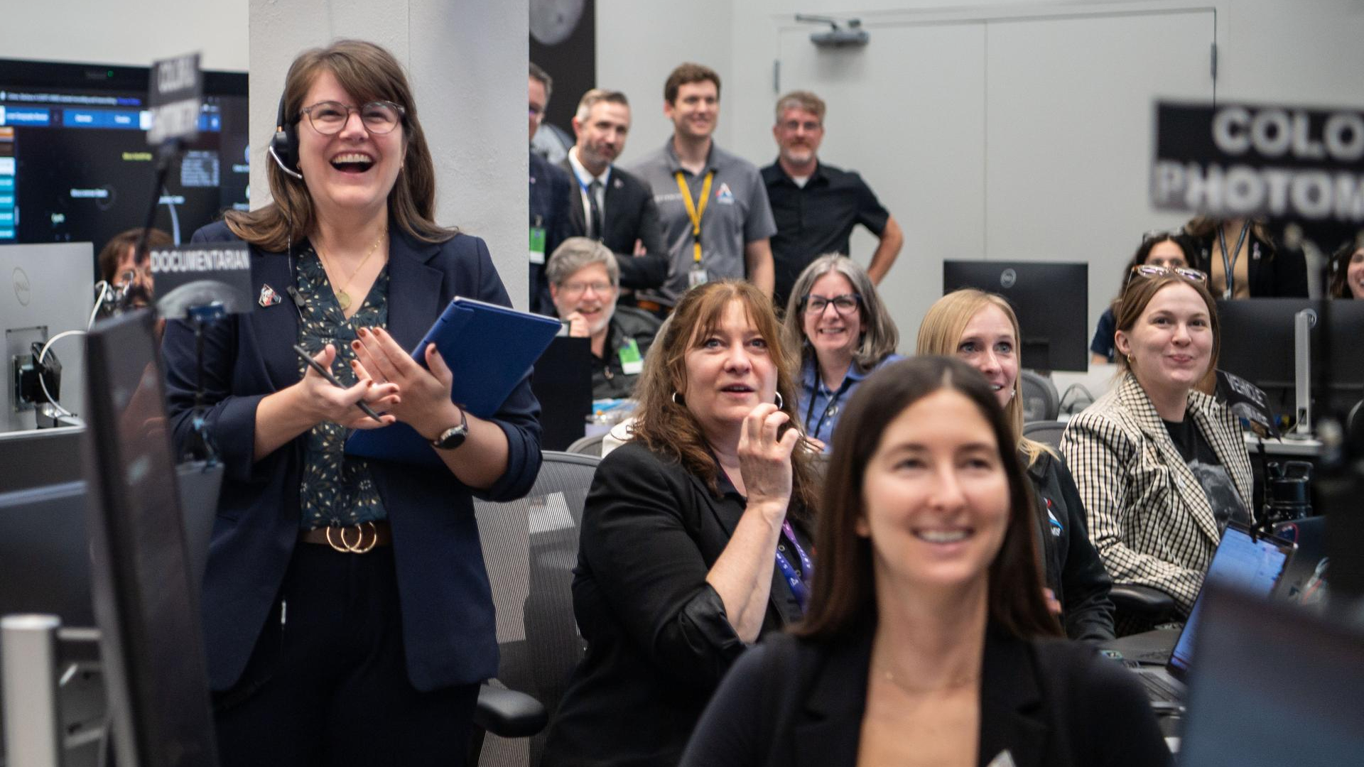 Mission team members are excited during Artemis II. 