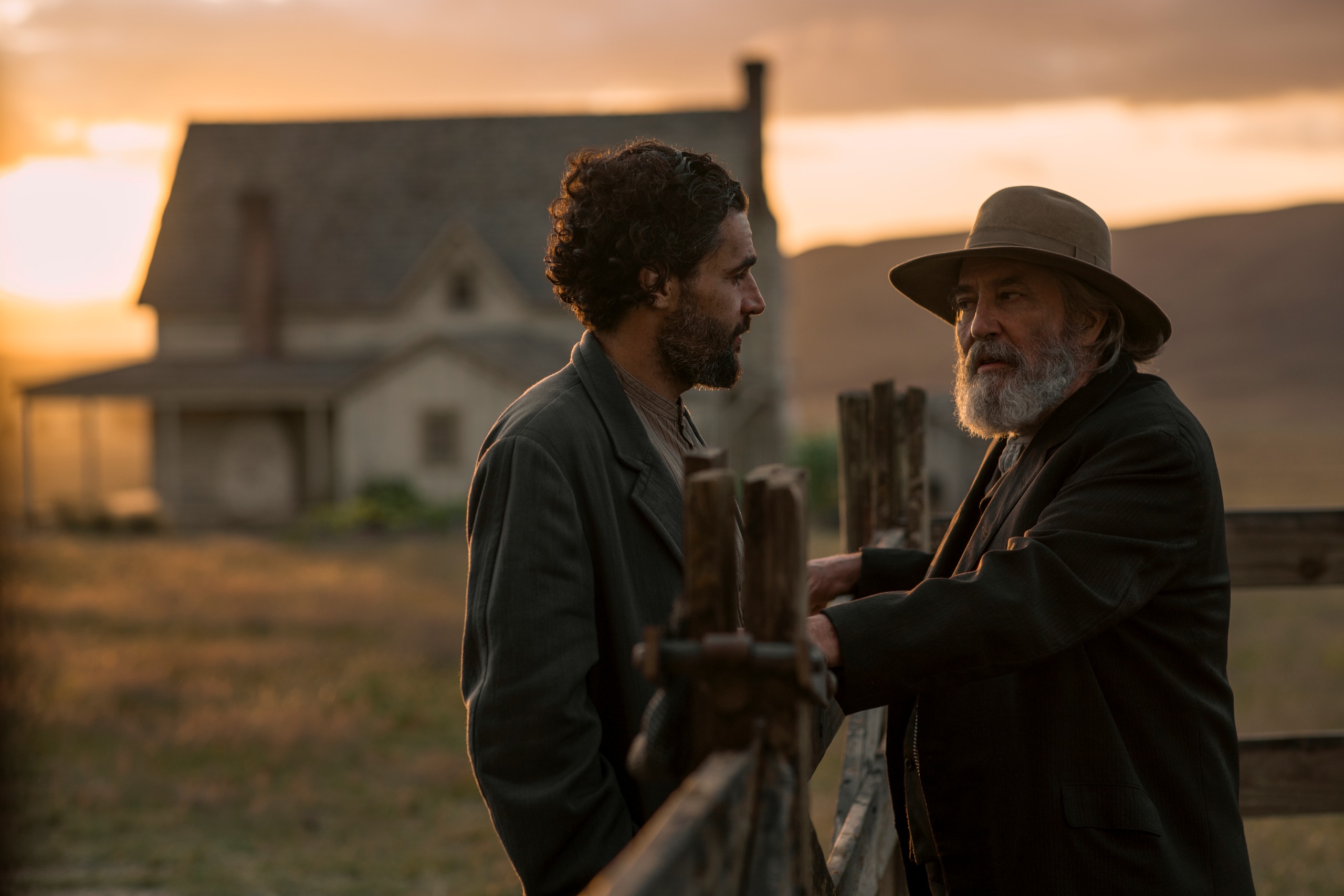 Christopher Abbott as Adam Trask talking to Ciara&amp;#769;n Hinds as Samuel Hamilton over a fence in front of the trask salinas farm house in east of eden