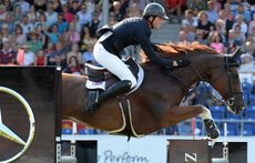 Ben Maher and Diva II on the third day of the European Showjumping Championships 2015. Picture by Peter Nixon
