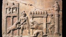 A Roman relief portraying a gladiator fending off lions.