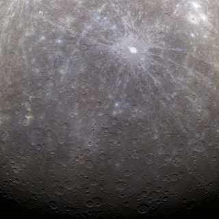 On March 29, 2011, NASA's Messenger spacecraft became the first probe ever to orbit Mercury. This image is the first color photo Mercury, showing the planet's southern polar region, acquired by Messenger from its new orbit. The Messenger probe arrived i