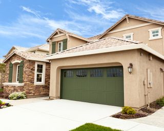 A suburban home with a garage and concrete driveway