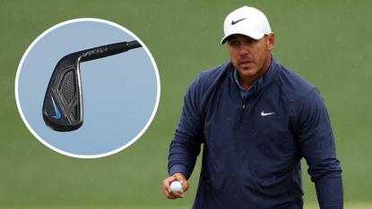 Koepka waves to the crowd with Nike iron in a bubble