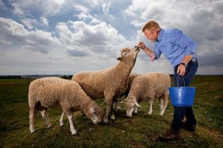 Adam Henson with a sheep