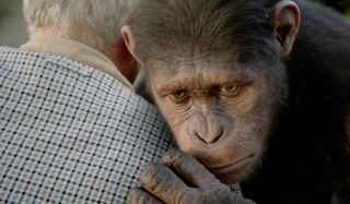 Rise of the Planet of the Apes Caesar shares a somber embrace
