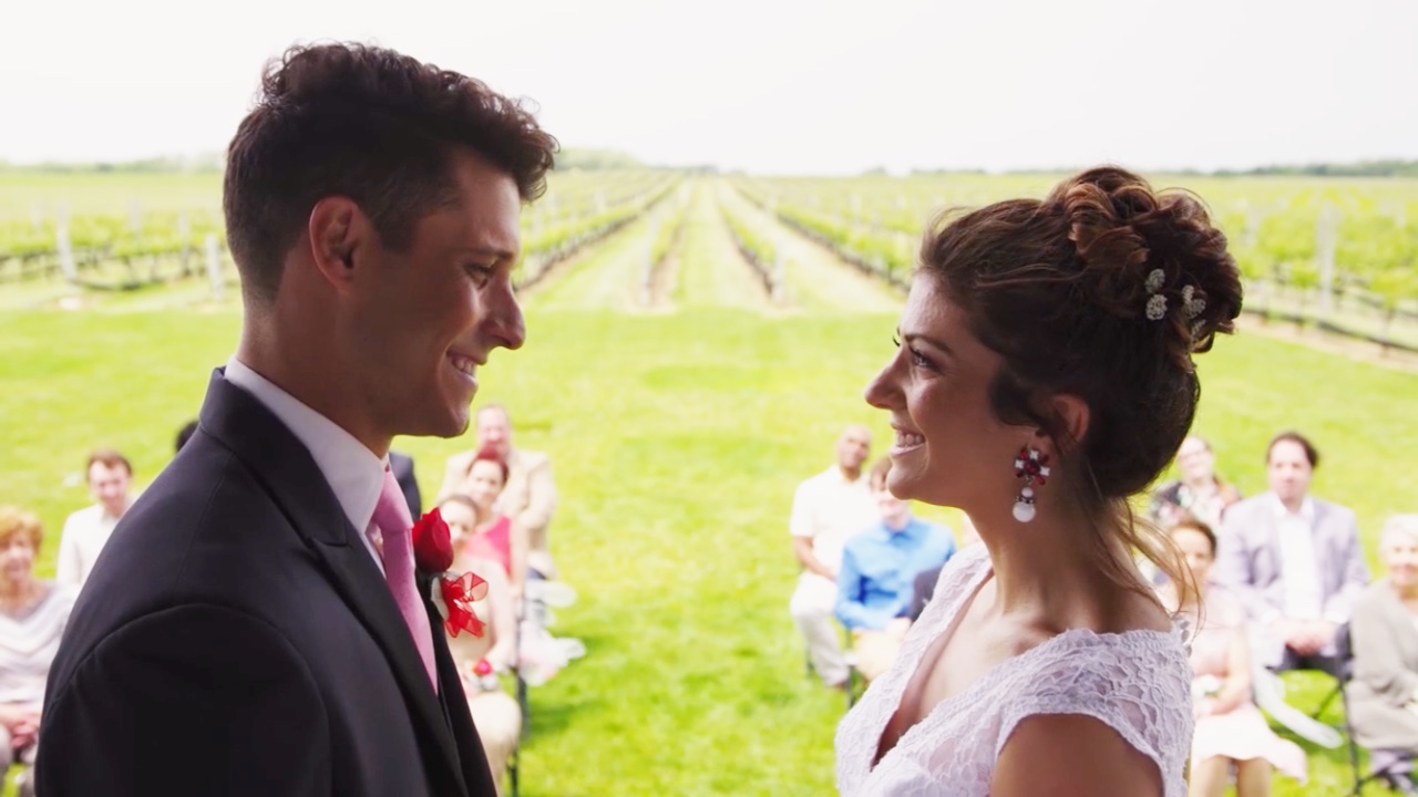 Ashley Brinkman and Cody Calafiore smile at each other in The Maltese Holiday.