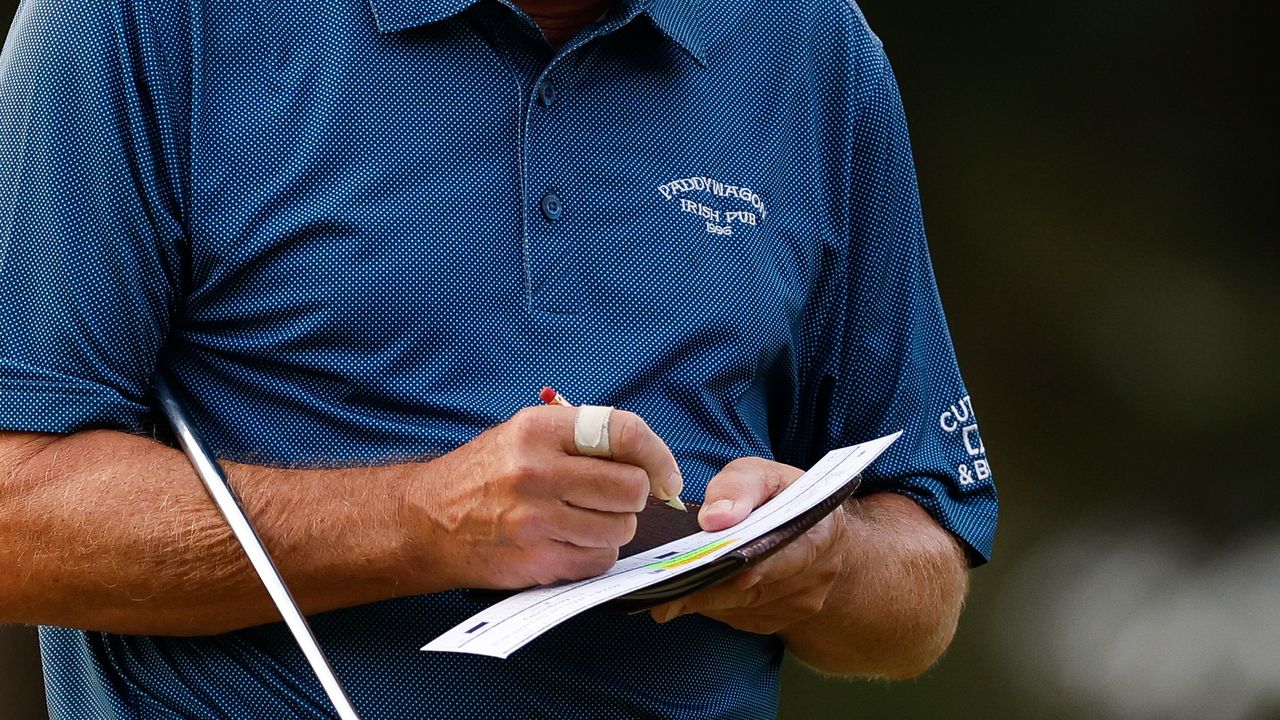 Generic image of a player marking a scorecard