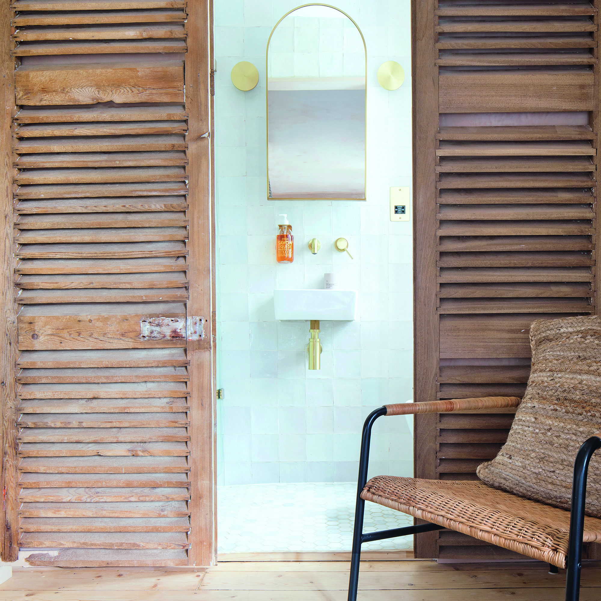 Ensuite bathroom with chair outside the door