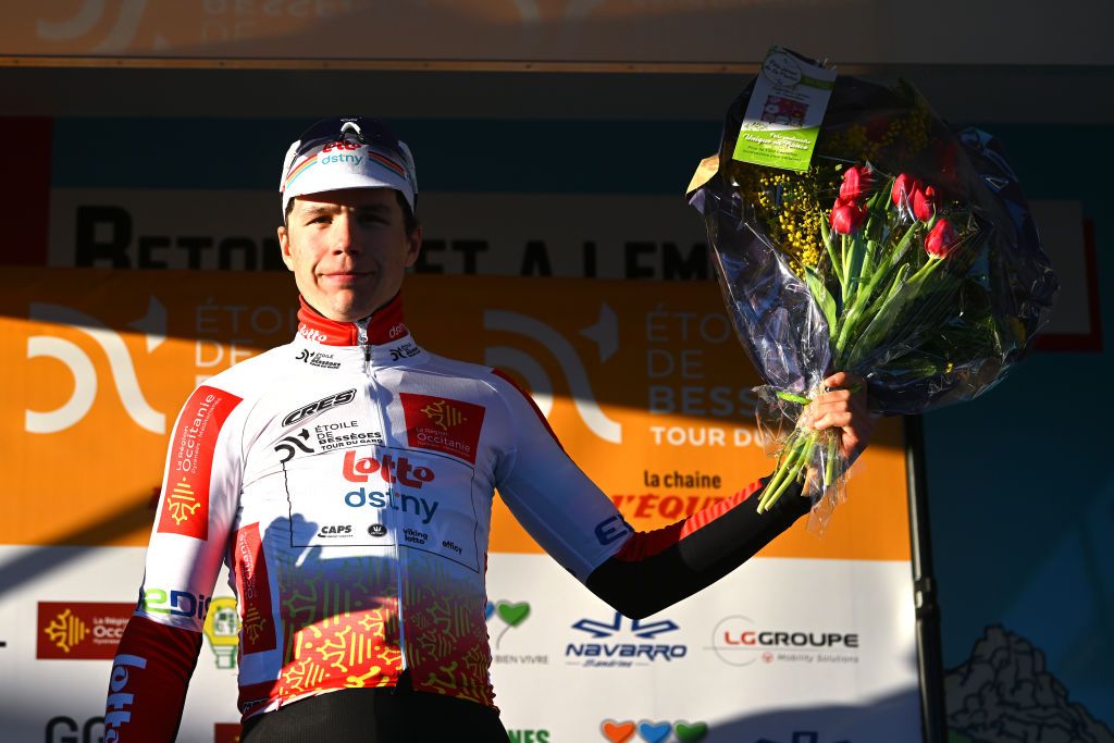 AUBAIS FRANCE FEBRUARY 02 Arnaud De Lie of Belgium and Team Lotto Dstny Orange leader Jersey celebrates at podium during the 53rd Etoile de Besseges Tour Du Gard 2023 Stage 2 a 16963km stage from Bagard to Aubais EDB2021 on February 02 2023 in Aubais France Photo by Luc ClaessenGetty Images