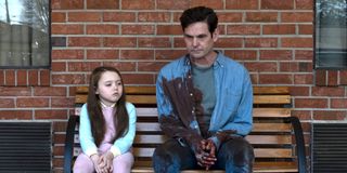 the haunting of hill house dad on bench covered in blood