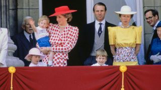 British Royals Diana, Princess of Wales holding her son, Prince Harry, alongside Captain Mark Phillips and Anne, Princess Royal, with their daughter Zara Phillips (front left) and Diana's son, Prince William (front right), Prince Richard, Duke of Gloucester, and Princess Alice, Duchess of Gloucester (1901-2004; partially obscured at the right edge of the image) watching the Trooping the Colour ceremony from the balcony of Buckingham Palace in London, England, 14th June 1986