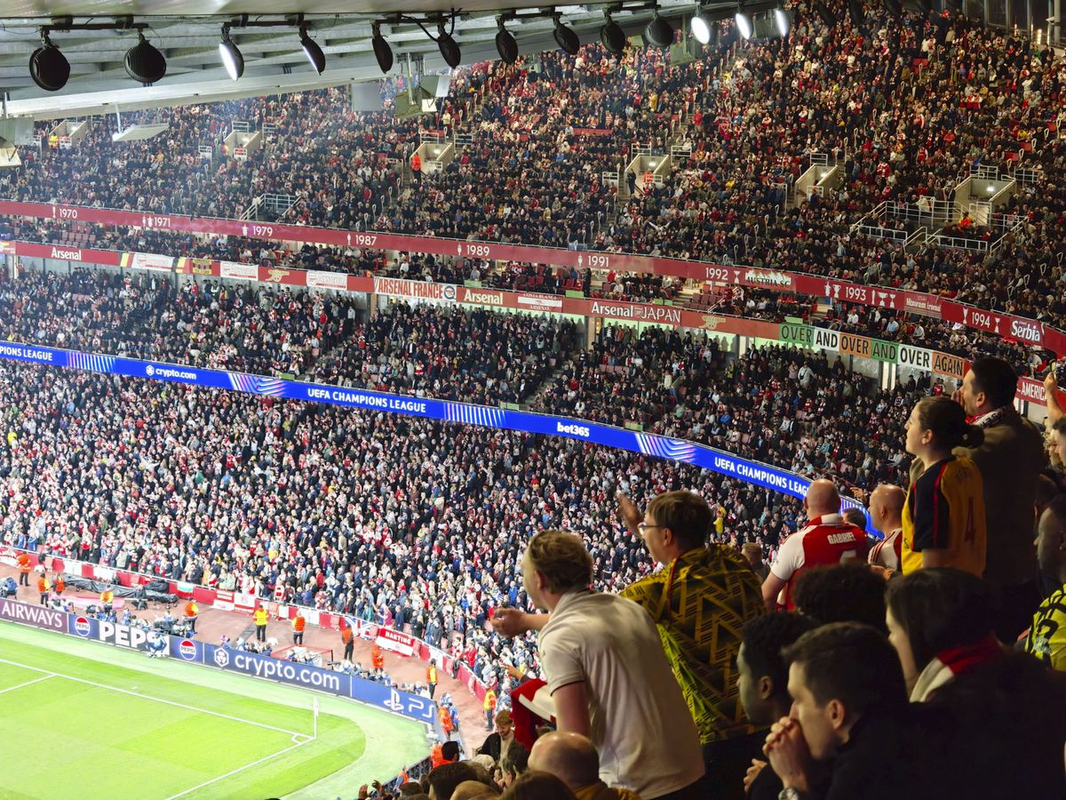 Action photos during a Champions League soccer match at Arsenal's Emirates stadium, taken with the Oppo Find X9 Ultra and teleconverter lens