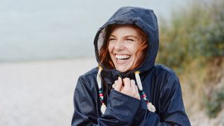 best women's waterproof jackets: smiley wet hiker