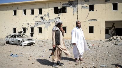 Taliban officials in Afghanistan observe site of Pakistan strike