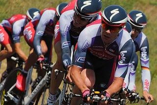 Cadel Evans pushes his Silence-Lotto teammates.