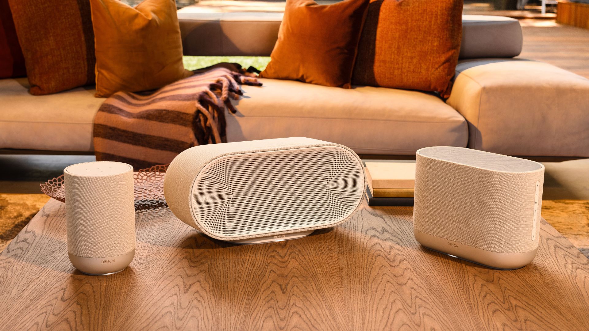 The Denon 200, 400, and 600 speakers on a table