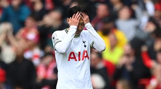 Son Heung-min holds his head as Tottenham concede early on away to Liverpool in the Premier League in April 2023.