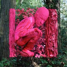 Pink structure of a man in a forest 