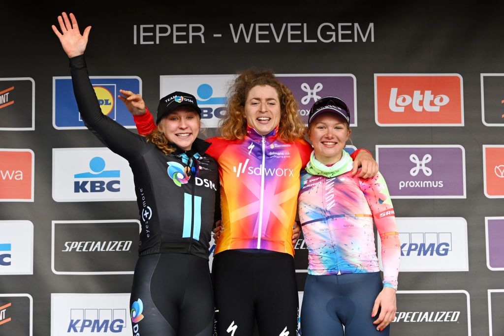 WEVELGEM BELGIUM MARCH 26 LR Megan Jastrab of The United States and Team DSM on second place race winner Marlen Reusser of Switzerland and Team SD Worx and Maike Van Der Duin of The Netherlands and Team CanyonSRAM Racing on third place pose on the podium ceremony after the 12th GentWevelgem In Flanders Fields 2023 Womens Elite a 1625km one day race from Ypres to Wevelgem UCIWWT on March 26 2023 in Wevelgem Belgium Photo by Luc ClaessenGetty Images