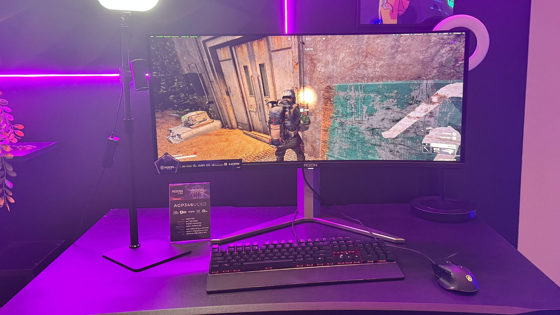 AOC AGP346UCSD gaming monitor on a black background, playing Arc Raiders