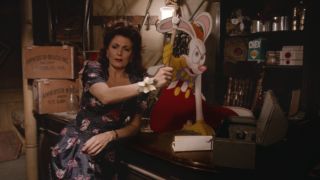 Joanna Cassidy grabs a hammer out of Roger Rabbit's hands in Who Framed Roger Rabbit.