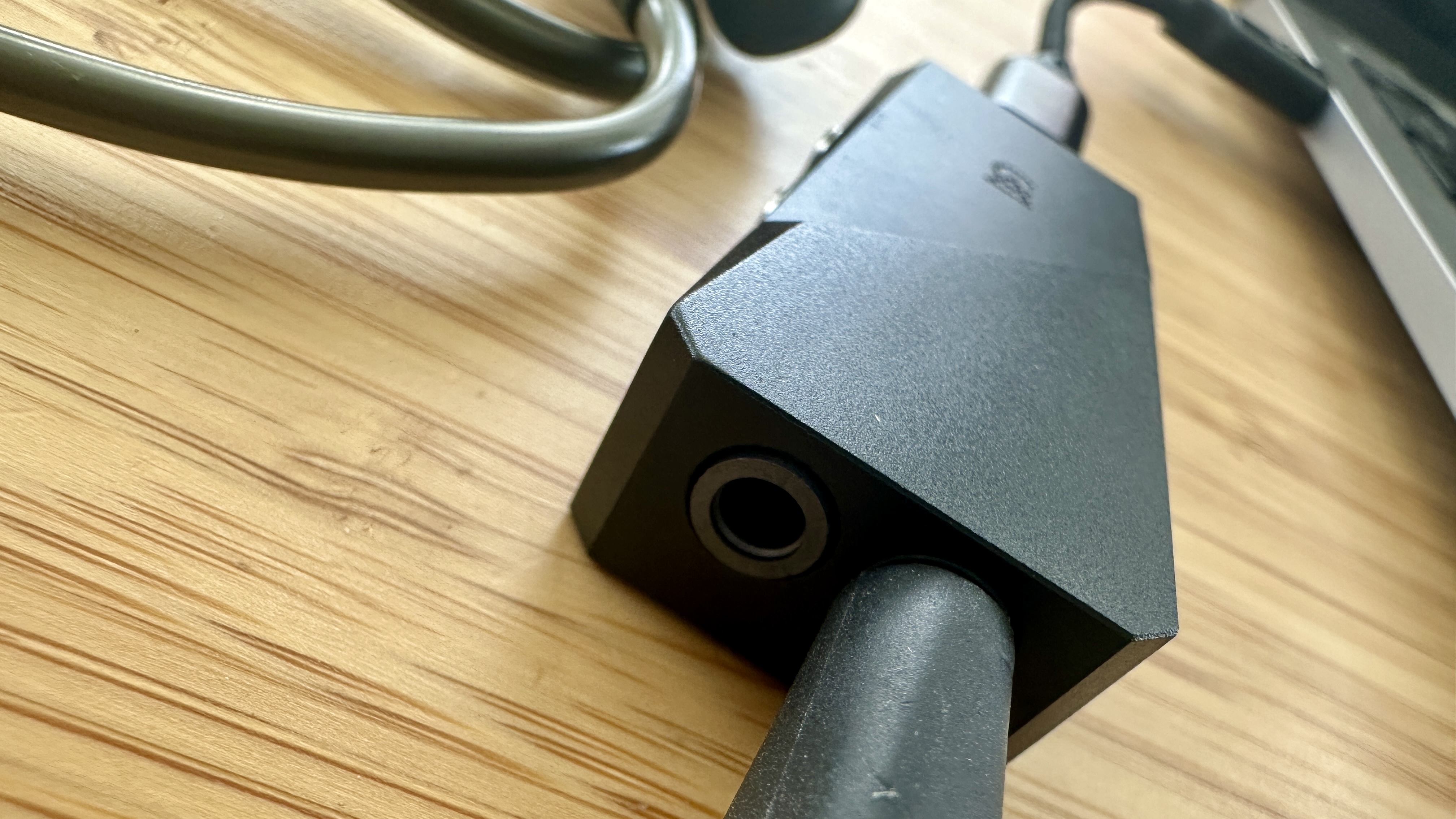 Output ports of the Campfire Audio Relay headphone amp/DAC on a wooden surface