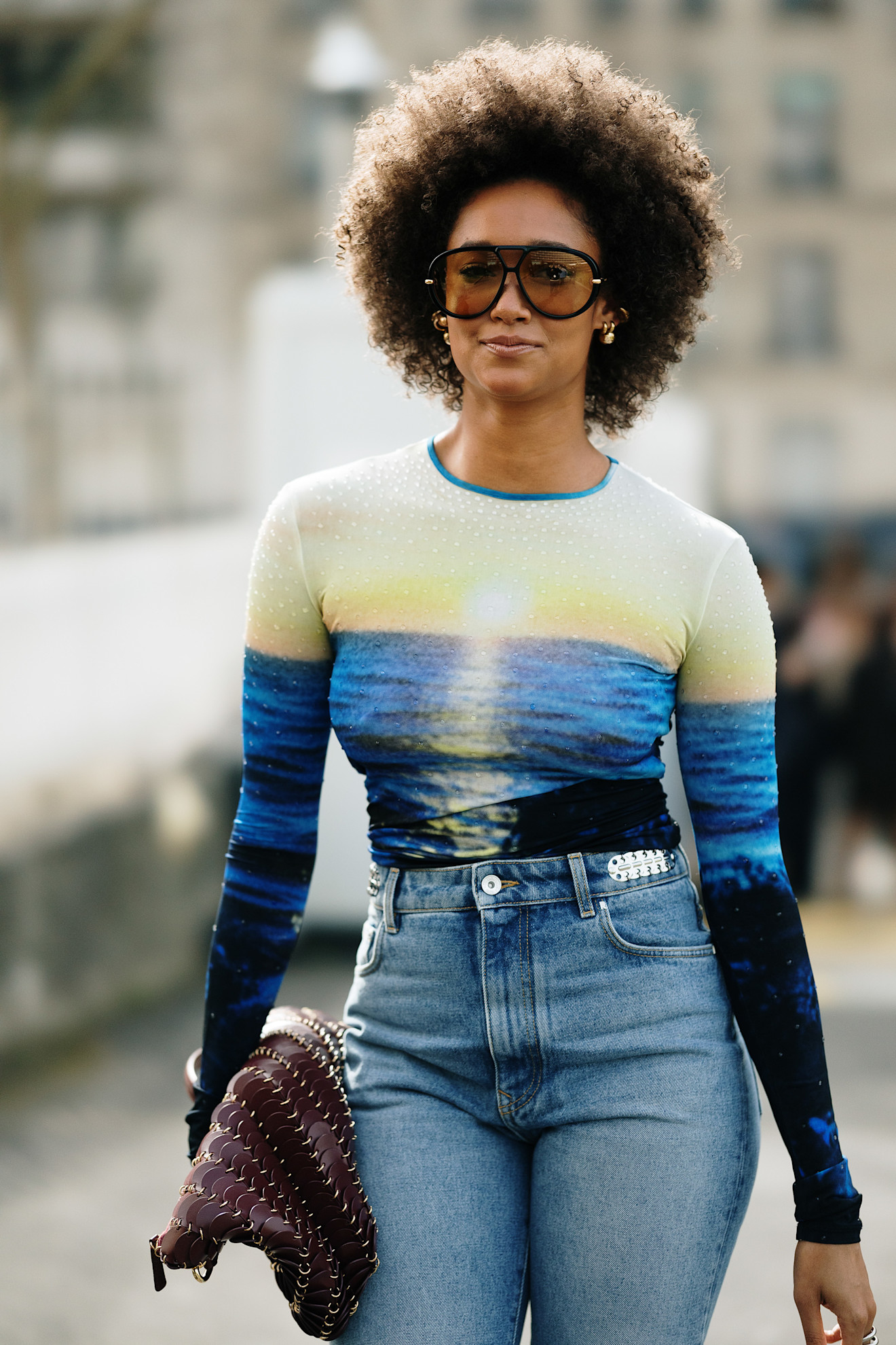 a stylish woman wearing oversize aviator sunglasses during paris fashion week 2026