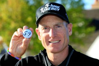 Jim Furyk holds up his ball