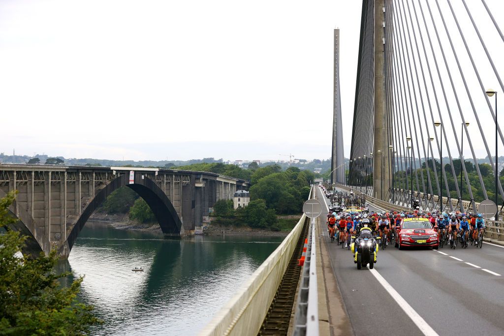 LANDERNEAU FRANCE JUNE 26 The Peloton passing through the Pont de lIroise in Brest City at start during the 8th La Course By Le Tour De France 2021 a 1077km race from Brest to Landerneau Cte De La Fosse Aux Loups 176m Landscape Bridge LaCourse LeTour TDF2021 UCIWWT on June 26 2021 in Landerneau France Photo by Tim de WaeleGetty Images
