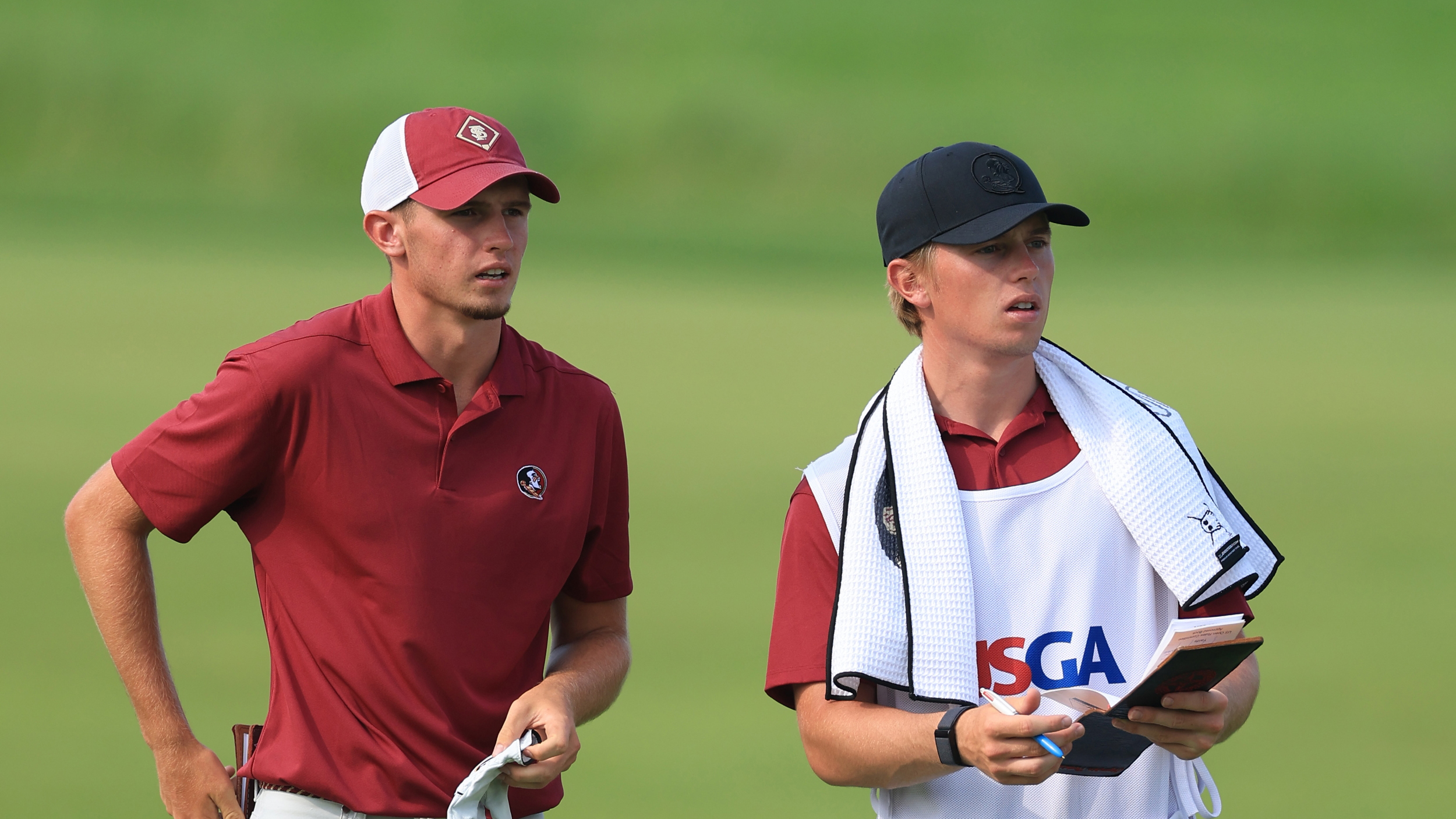 Tyler Weaver (left) and his brother, Max prepare for a shot during the 2025 US Open at Oakmont Country Club