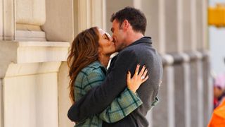 Jennifer Lopez and Ben Affleck hold each other close and kiss