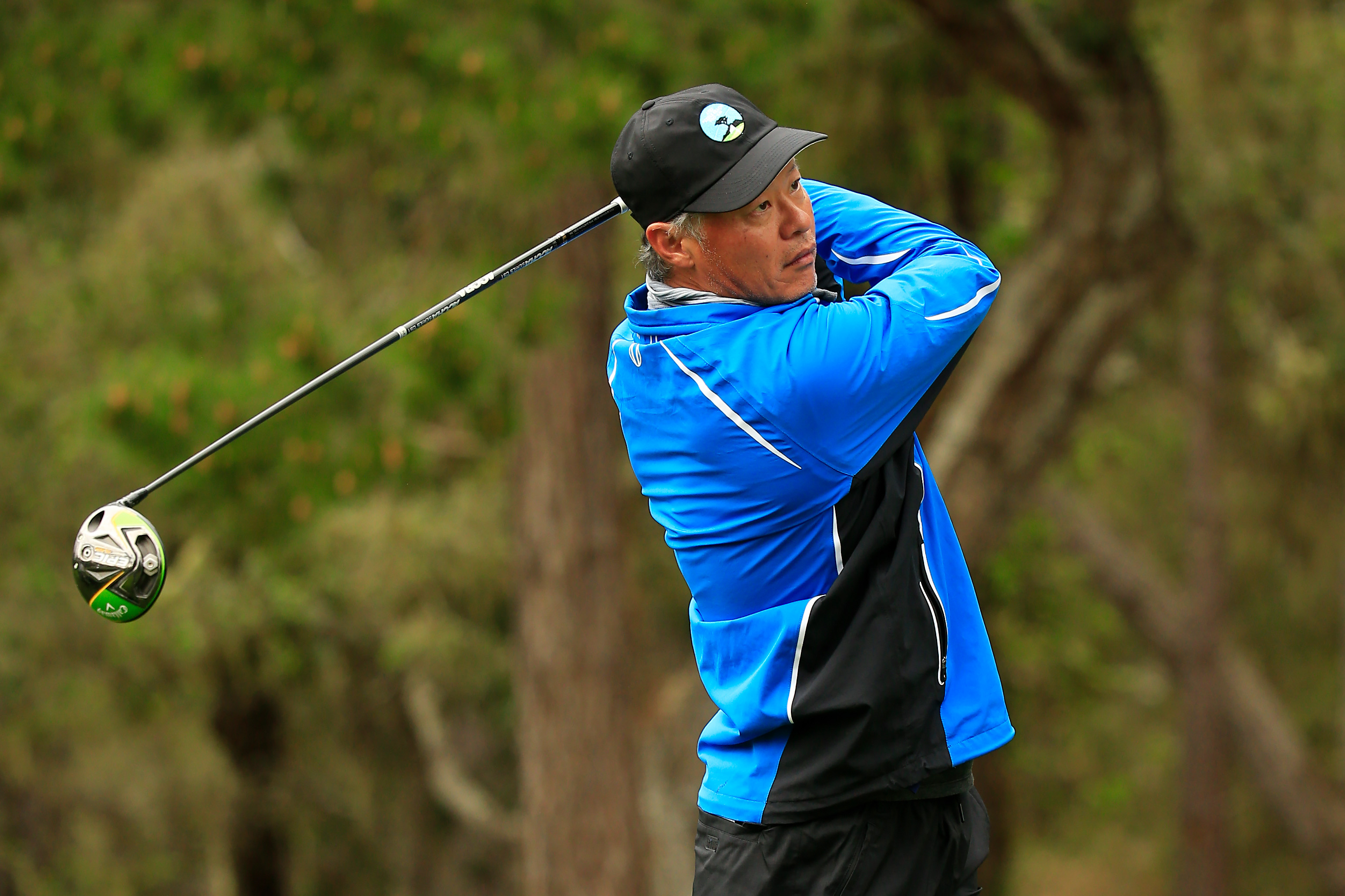 Jerry Yang holds his finish on a drive