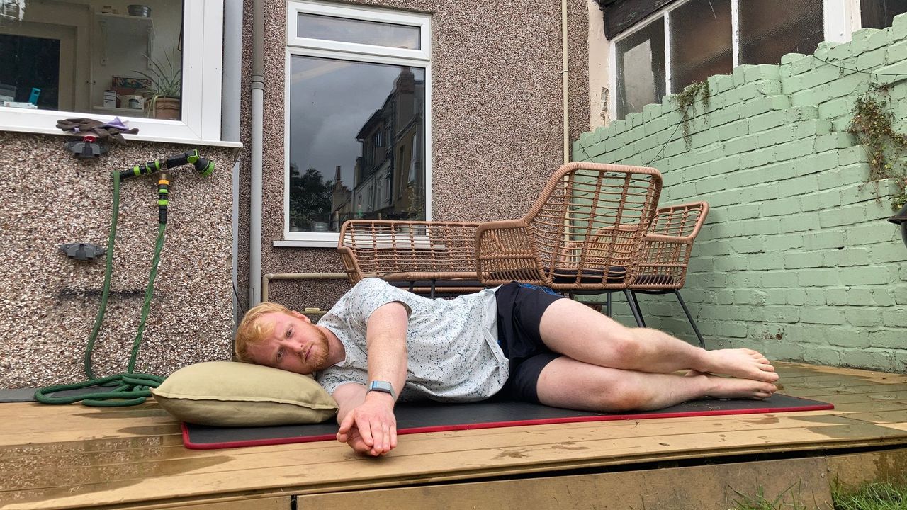 Fit&amp;Well fitness writer Harry Bullmore performing the book opening stretch