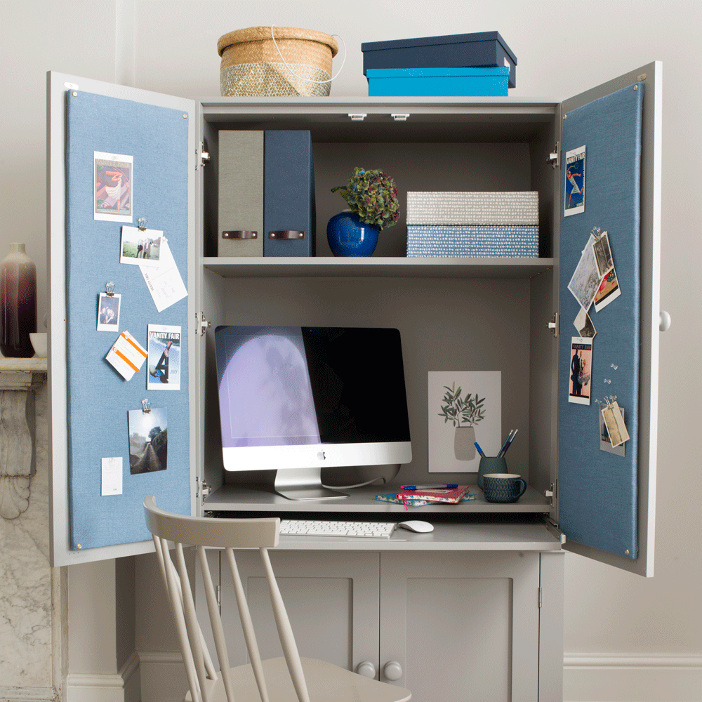 cupboard with builtin desk with computer and chair