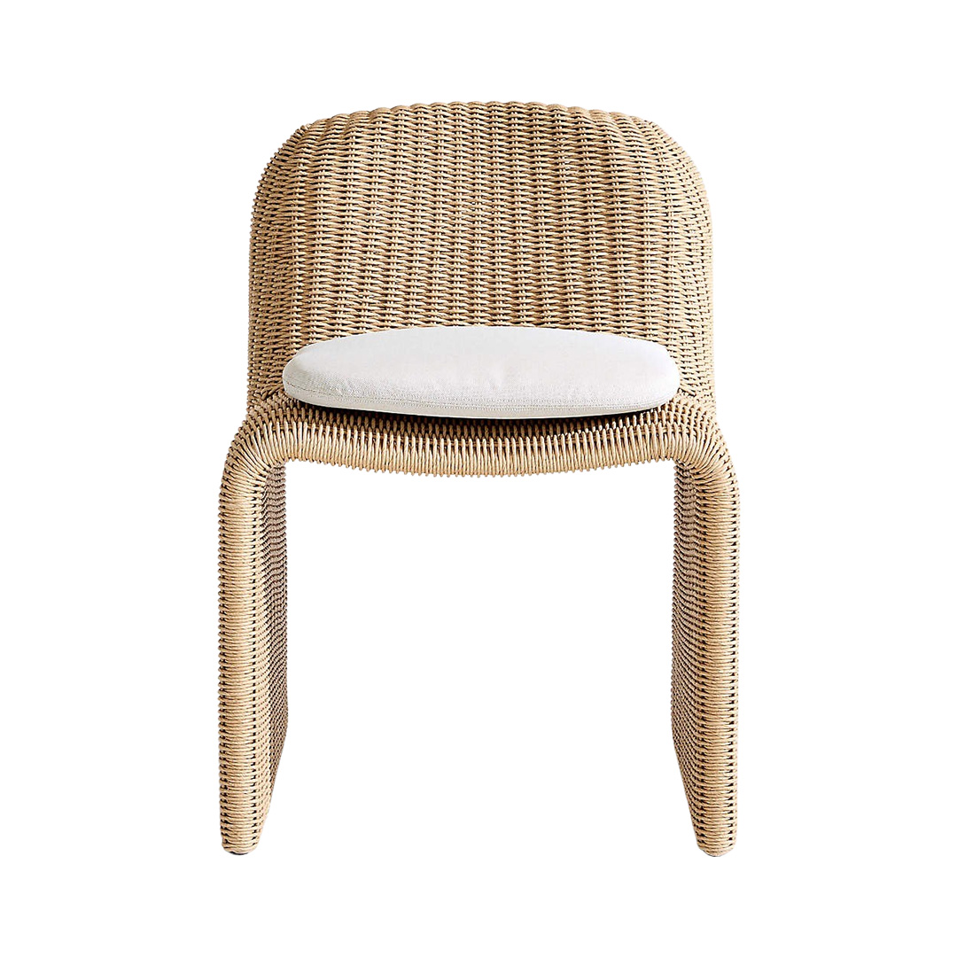 Outdoor wicker dining chair with white cushion 
